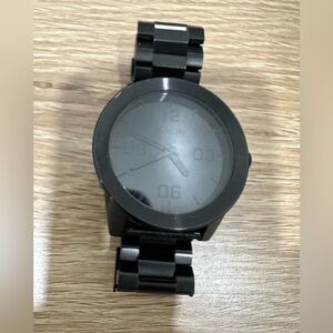 Black on black Nixon watch